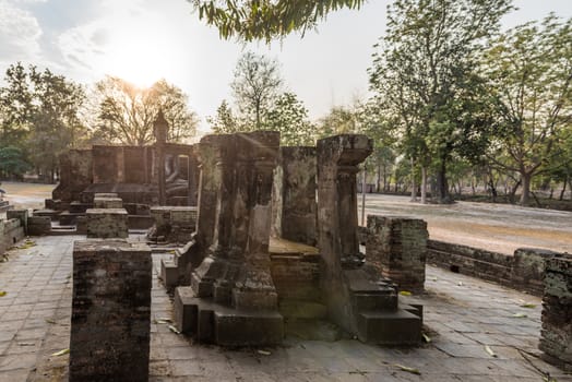 Sukhothai historical park, Wat Si Chum temple, ruins of a small chapel with Buddha statue