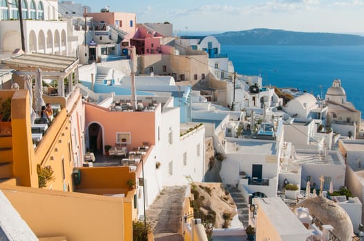 White houses of the Santorini village on the top of the rock