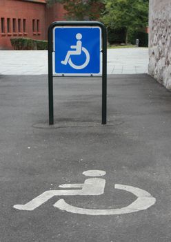 Two signs for a handicap parking area