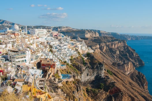 White houses of the Santorini village on the top of the rock
