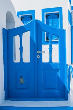 View of the traditional greek yard with blue door