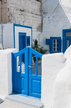 View of the traditional greek yard with blue door