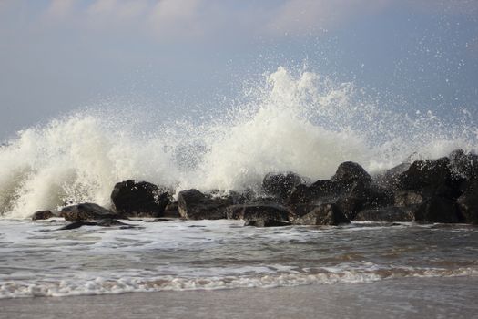 Waves breaking against large stones at Northern Sea