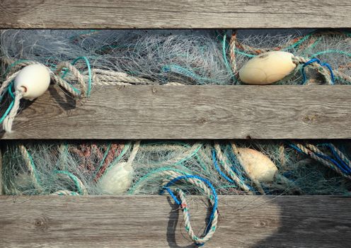 Blue industry fishing nets in old wooden storage box