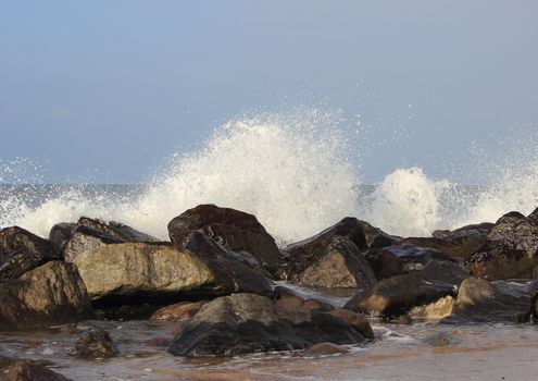 Waves breaking against large stones at Northern Sea