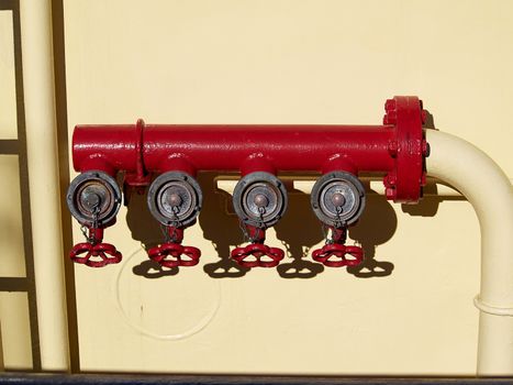Industrial red fire hydrant emergency gear on a boat