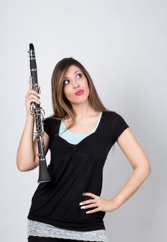 woman perplexed with her clarinet