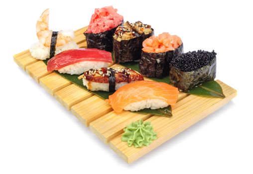 Sushi set assorrted rolls on on bamboo board isolated on white