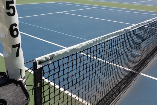 Tennis court sideline on a sunny day