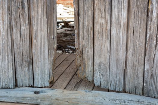 Old wood framed wall in abandoned house