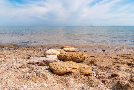 Stones on the beach, sunny summer day.