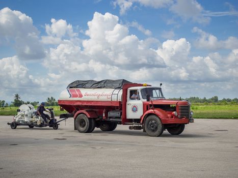Myeik, Myanmar - June 8, 2016: Due to lacking road and railway infrastructure, Myanmar relies heavily on air transport for travelling. Technology is often basic, like the refueling gear at Myeik Airport in Tanintharyi Region.