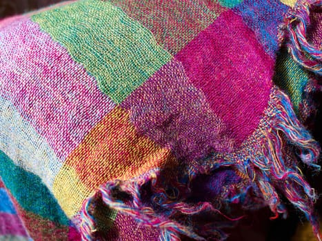 Colorful ethnic hand woven fabric material cloth on display in a market