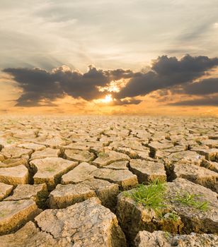 Global warming concept. drought land under the evening sunset