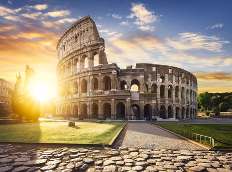 View of Colosseum in Rome and morning sun, Italy, Europe.