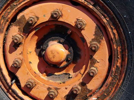 Old rusty bolts ,nuts and heavy screws on aged metal part of machinery                               