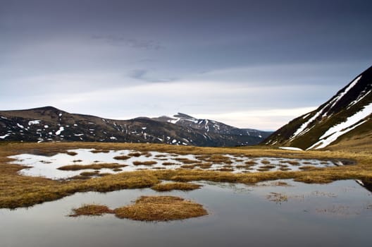 Beauty of Northern nature. Mountain river in spring landscape