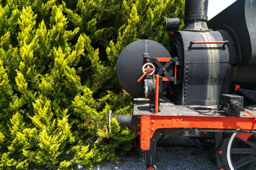 Close up detailed view of historical old rusty iron train locomotives.