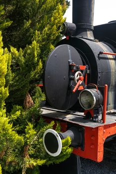 Close up detailed view of historical old rusty iron train locomotives.