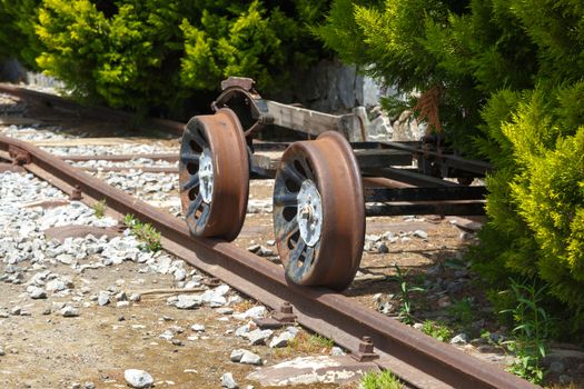 Close up detailed view of historical old rusty iron train locomotives.