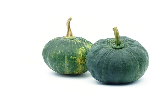 Double green pumpkin on white background. Two small green pumpkin on white background. object side view.