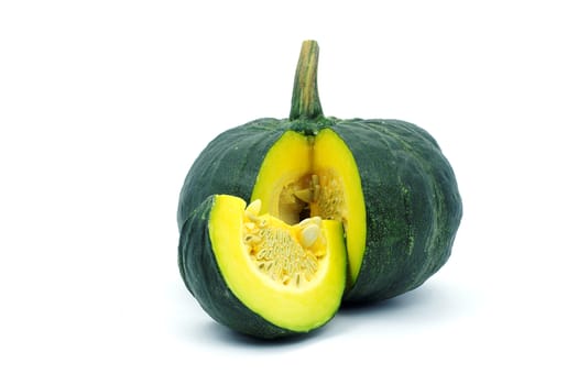 A yellow piece of pumpkin and green pumpkin on white background. A yellow sliced pumpkin and green pumkin on white background.