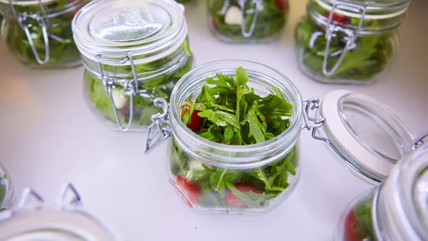vegetable salad in glass jar on white background. Shallow dof