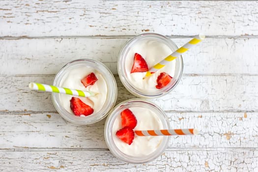 Yogurt with strawberries in a jar. top view
