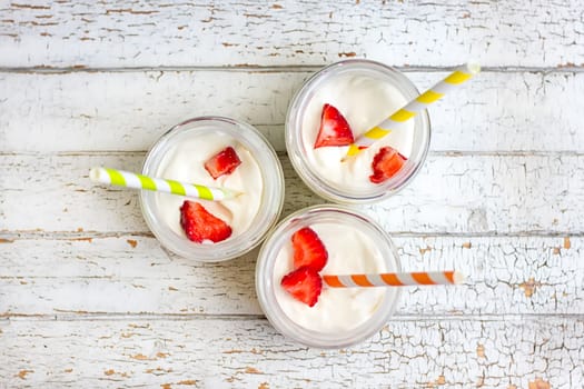 Yogurt with strawberries in a jar. top view