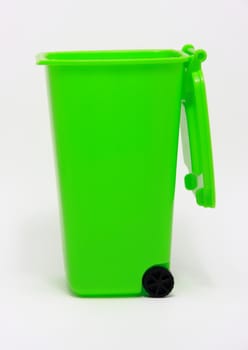 Isolated green waste bin on white background
