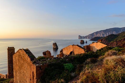 Ruins of industrial mining along the west coast of Sardinia. Panorama at sunset. The Marmora washery.