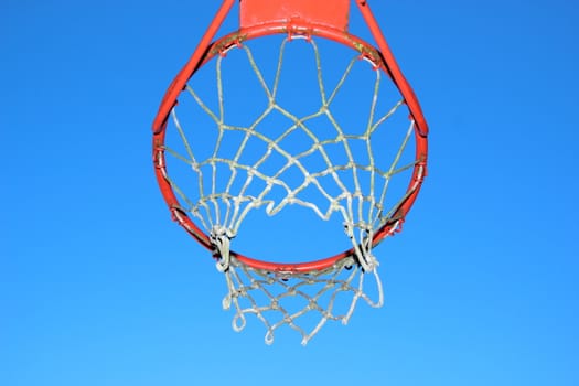 Isolated basketball net on blue sky background