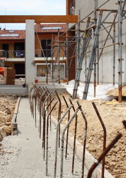 Concrete mould with metal spikes at construction site