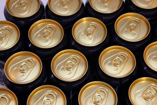 Top view of beer cans with golden top