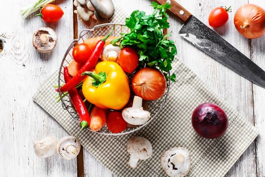 Vegetable set fresh mushrooms,peppers,onions on light background