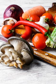 Vegetable set fresh mushrooms,peppers,onions on light background