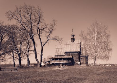 Wooden St. Nicholas church surrounded with trees in Suzdal, Russia