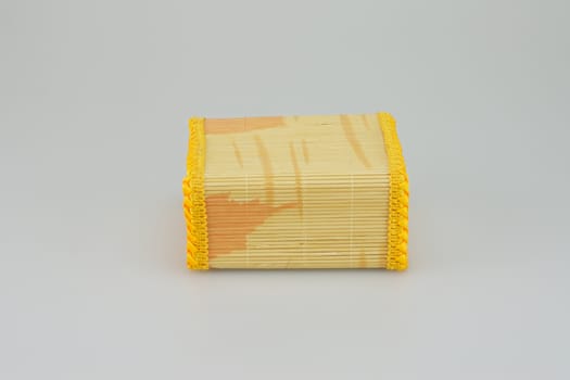 Square shaped bamboo box  on white background, handicraft from Thailand.