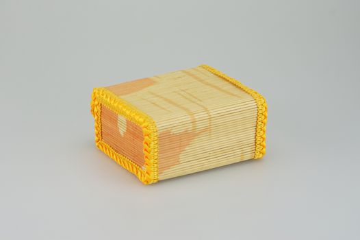 Square shaped bamboo box  on white background, handicraft from Thailand.