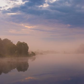 Misty morning on the lake. Spring in Belarus