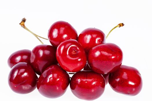 heap fruits of red cherry isolated on white background.