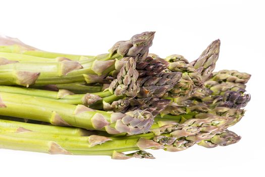 heap of green asparagus  vegetables isolated on white background.