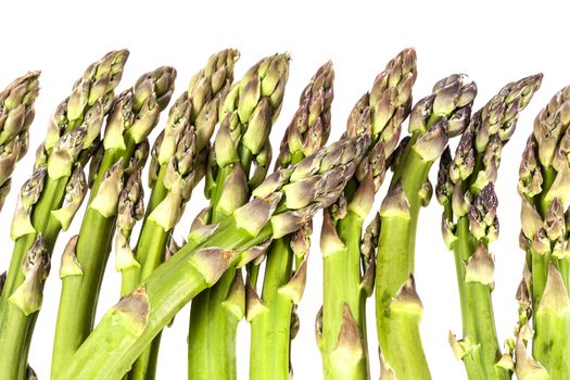 heap of green asparagus  vegetables isolated on white background.