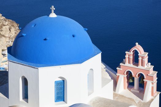 Santorini, Greece. Traditional architecture church in Oia village, landmark of Greek Islands, Aegean Sea.