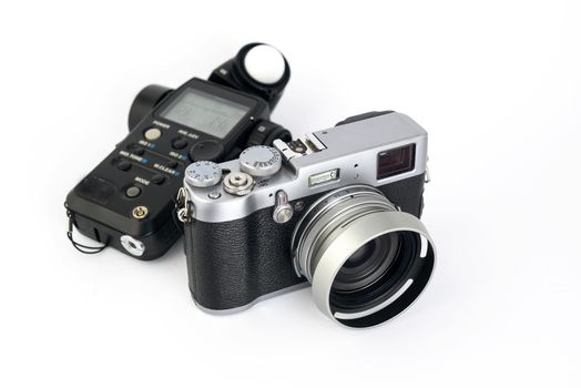 light meter and camera device on a white background