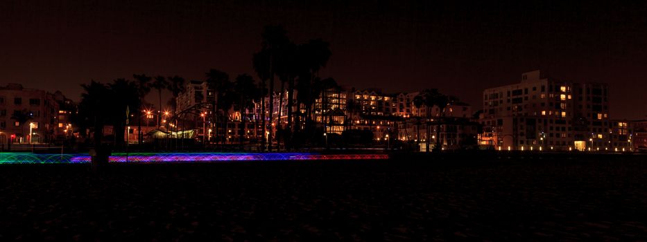 Santa Monica, California — April 24, 2016: Santa Monica Pier boardwalk lit up at night in Southern California. Editorial use.