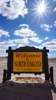 Welcome to North Dakota road sign with blue sky