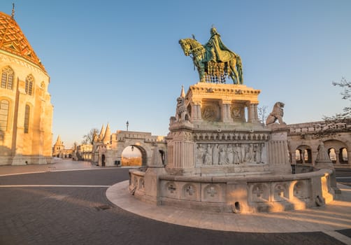 Saint Stefan Statue at Fisherman's Bastion, in Budapest, Hungary with Clear Blue Sky in Background at Sunrise