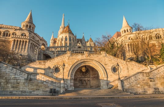 Sunlit Fisherman's Bastion in Budapest, Hungary at Sunrise. View from below.