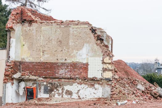 Demolition of a building in urban environments. House in ruins.